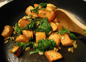 Mustard Greens with Roasted Sweet Potatoes and Toasted Pumpkin Seeds